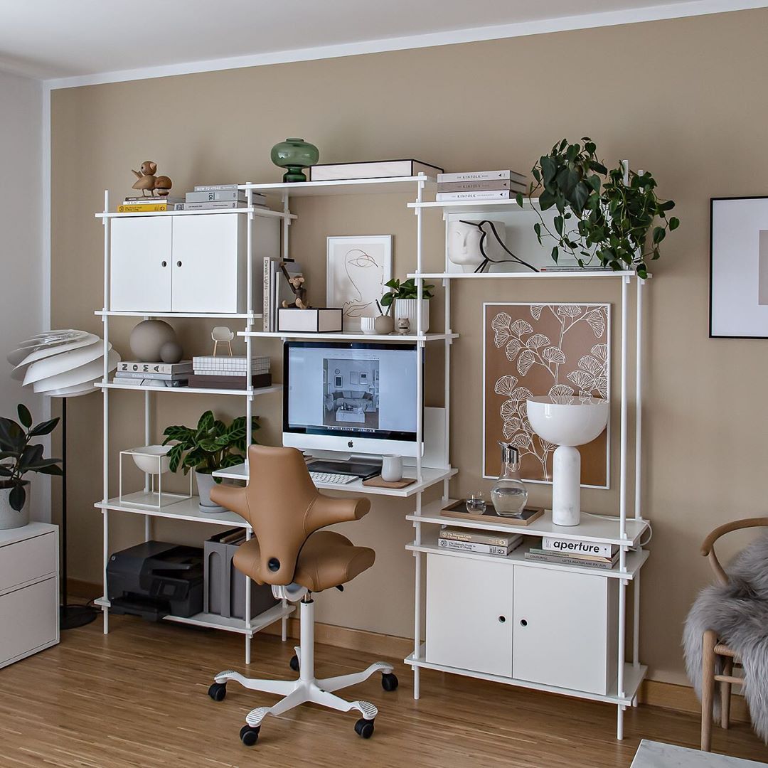 brown hag capisco chair in leather in home office