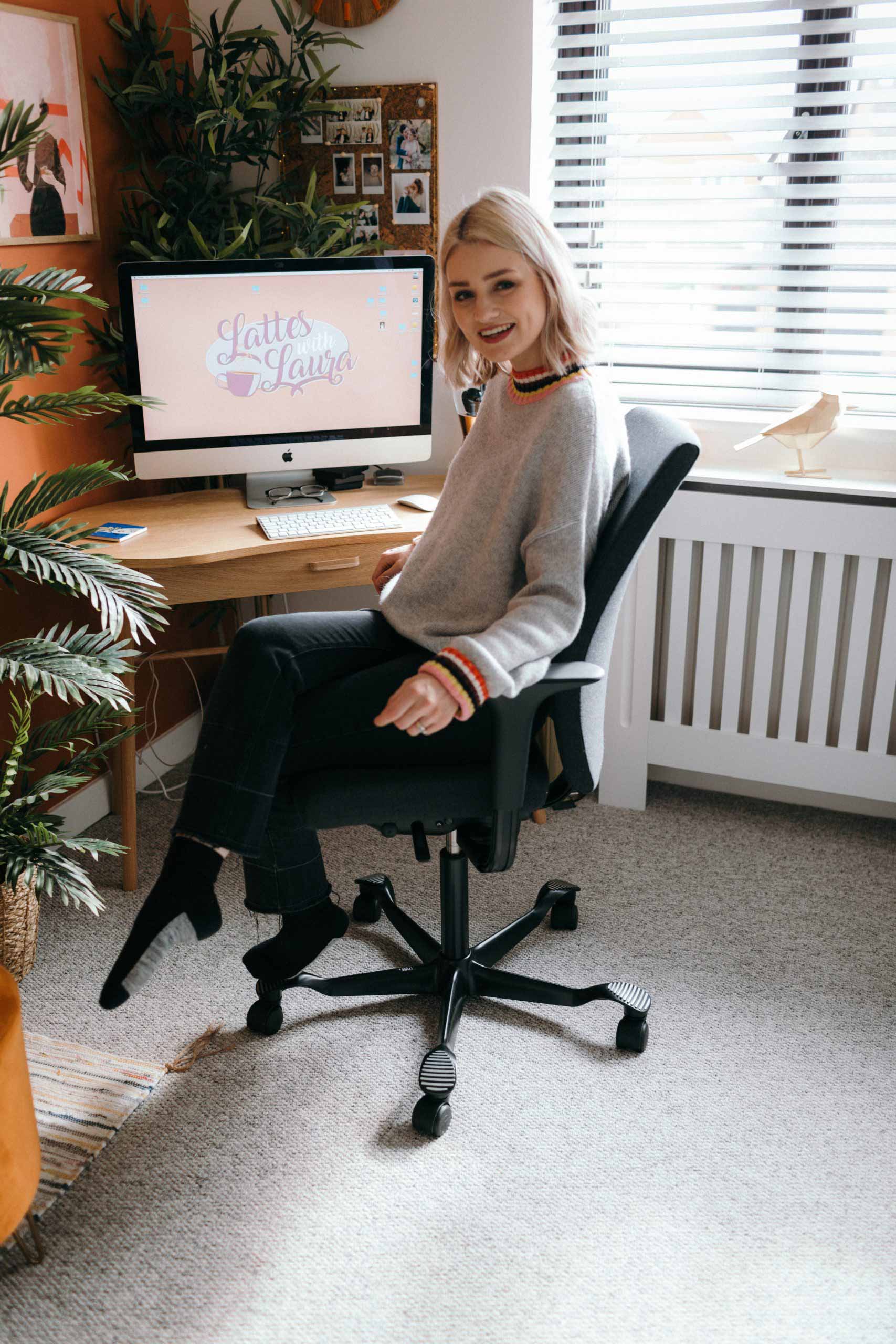 Youtuber Laura Bradshaw sat on a HÅG Creed chair in a home office