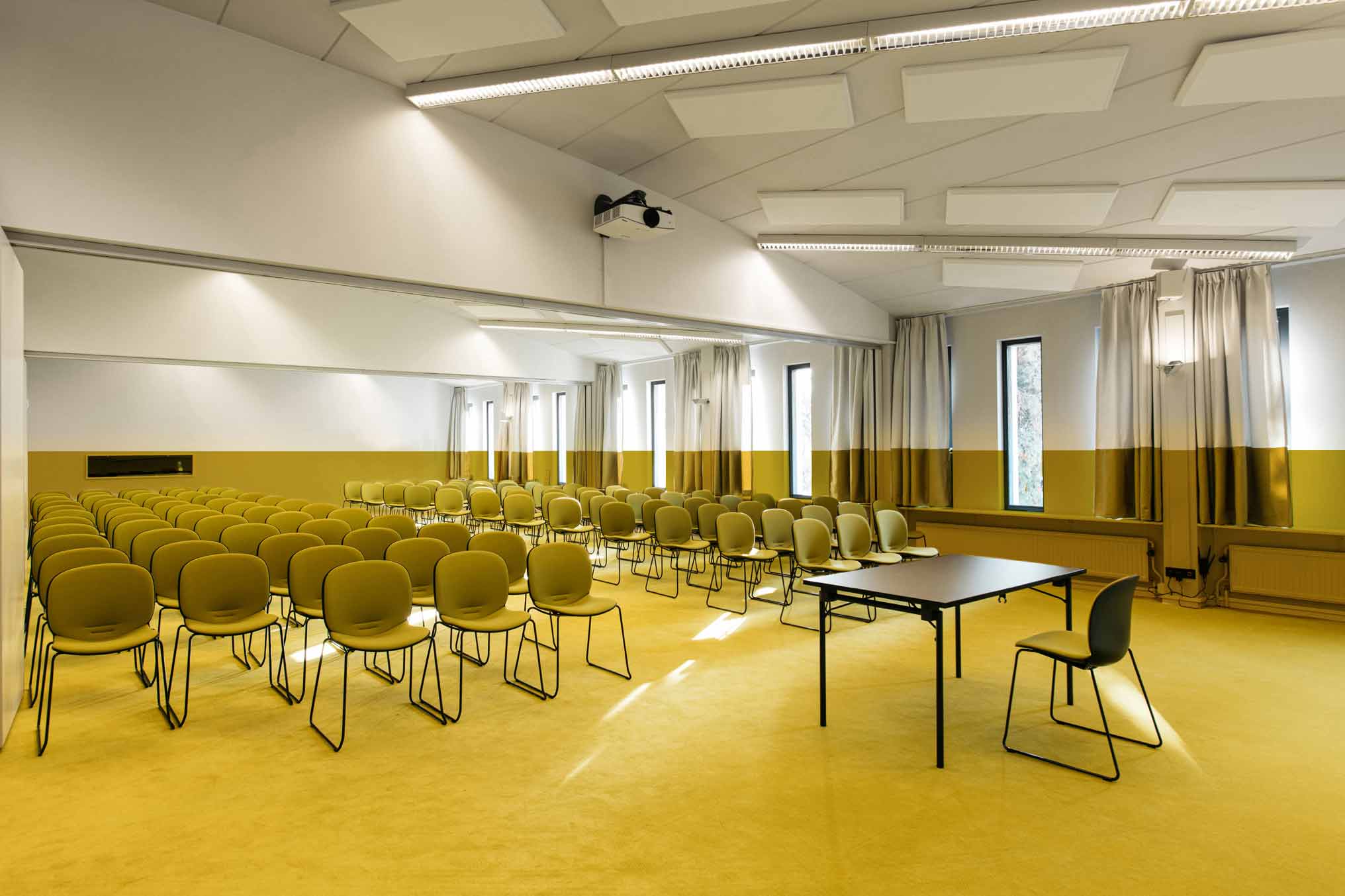 Yellow meeting room featuring RMB Noor in yellow fabric by gabriel