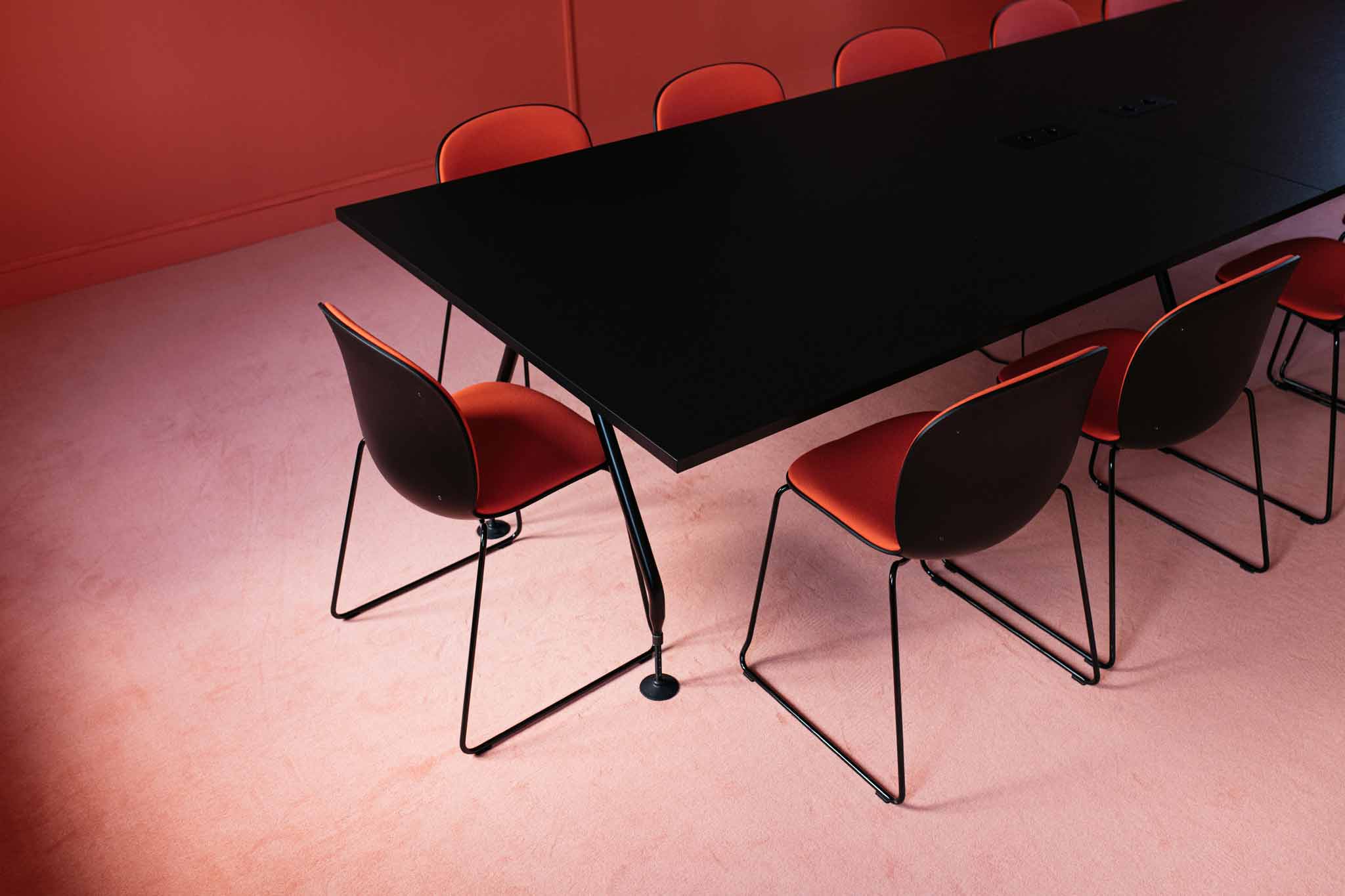 Close up of RBM Noor chairs in red with graphite shell at Vaesharltelt Hotel, Netherlands