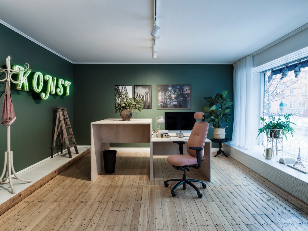 RH New Logic chair in an office with wooden floor and greenwalls