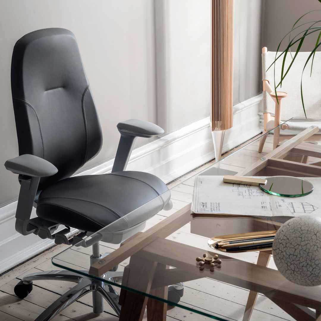 black leather RH Mereo chair at glass table